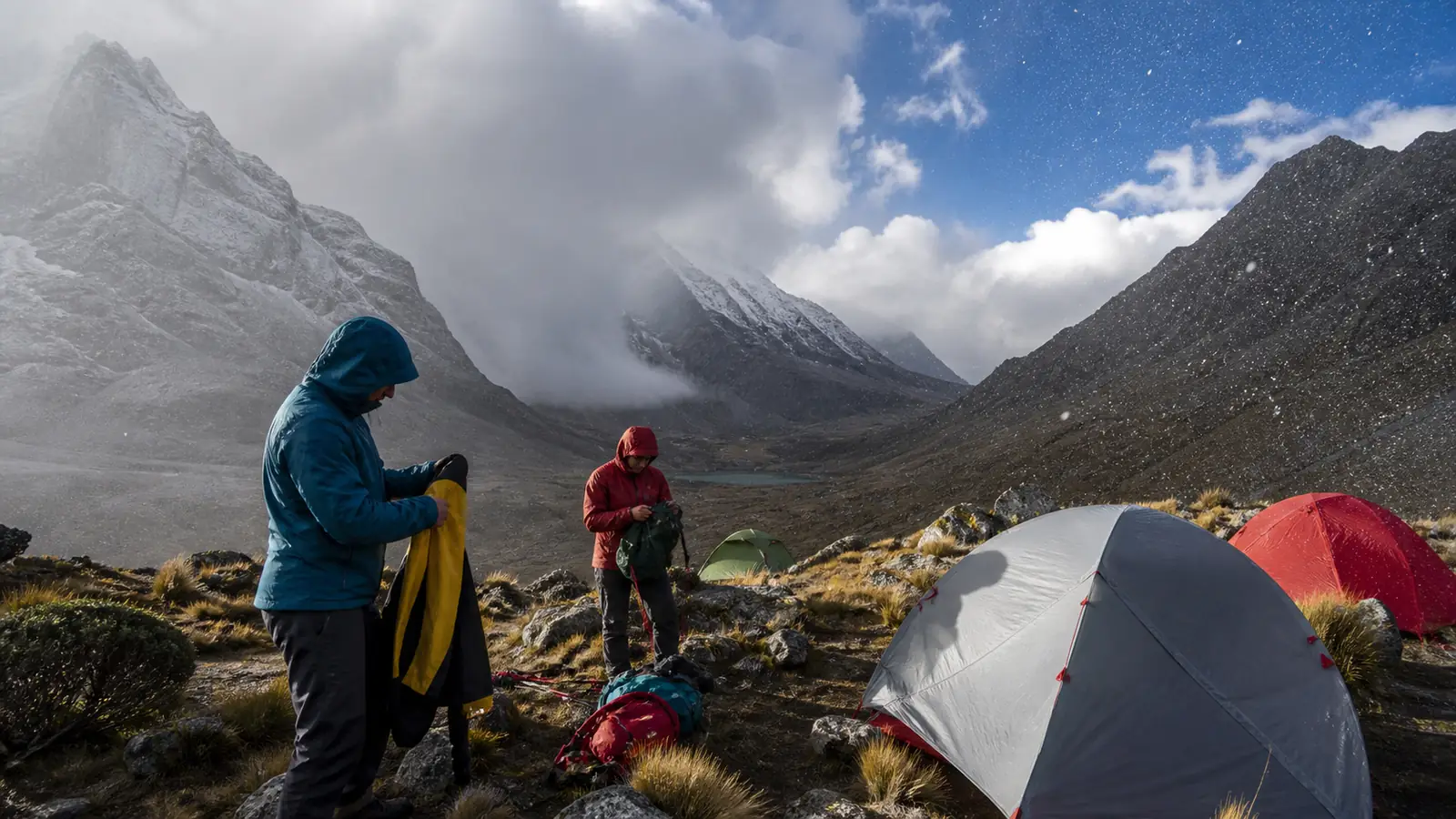 Trekking camp in the Cordillera Huayhuash prepared for sun, wind, rain and cold mountain conditions